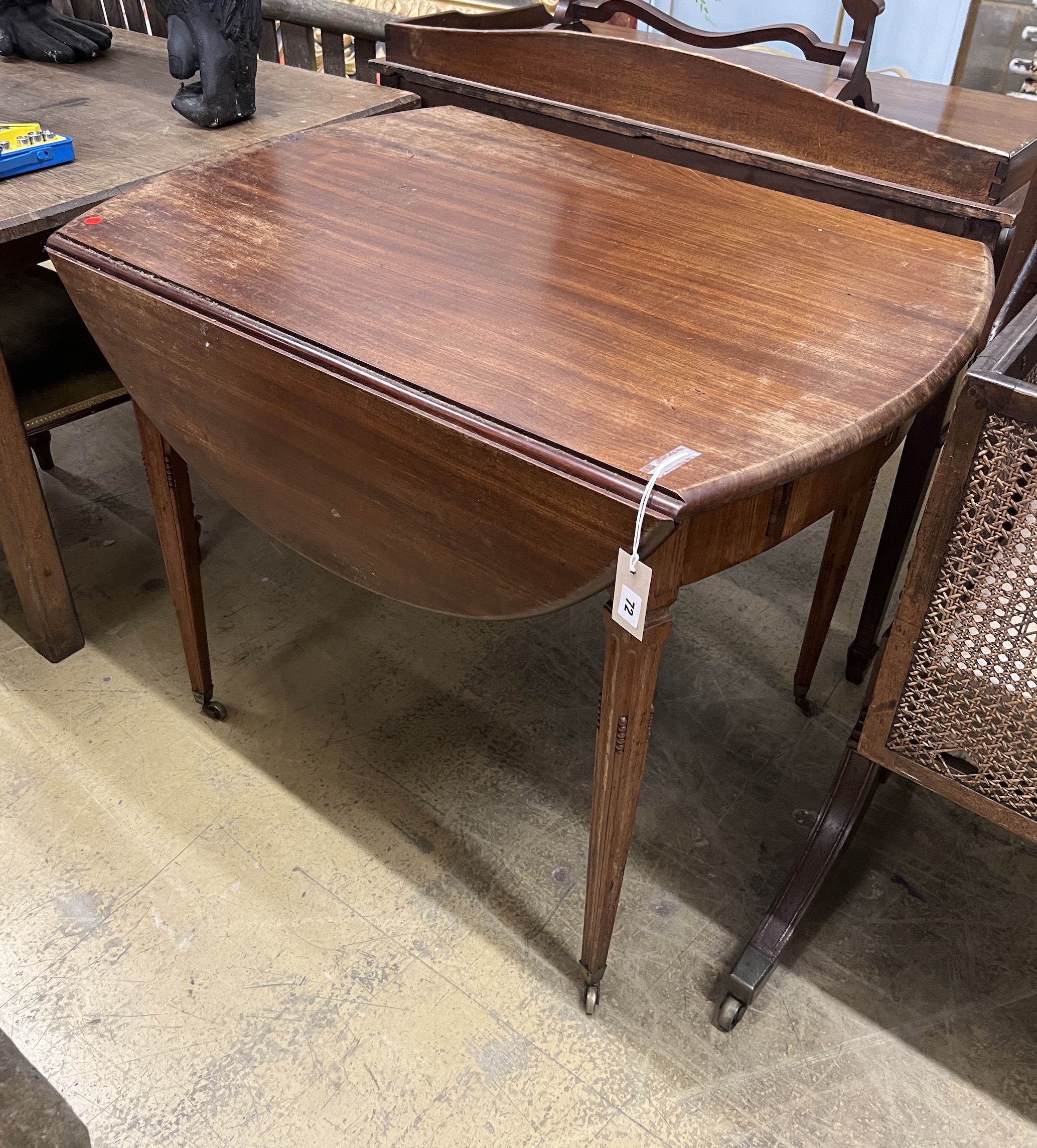 An early 19th century Continental mahogany oval Pembroke table, width 96cm, depth 70cm, height 75cm